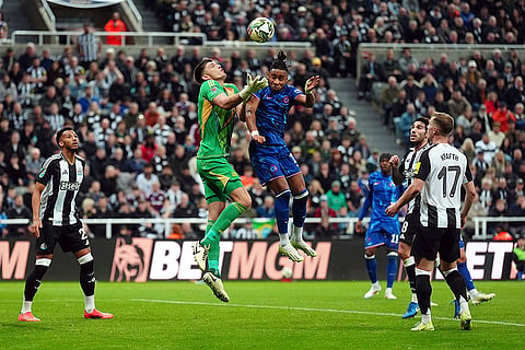 EFL Cup Quarter-Finals: Newcastle United goalkeeper Nick Pope, left, and Chelsea's Christopher Nkunku battle for the ball