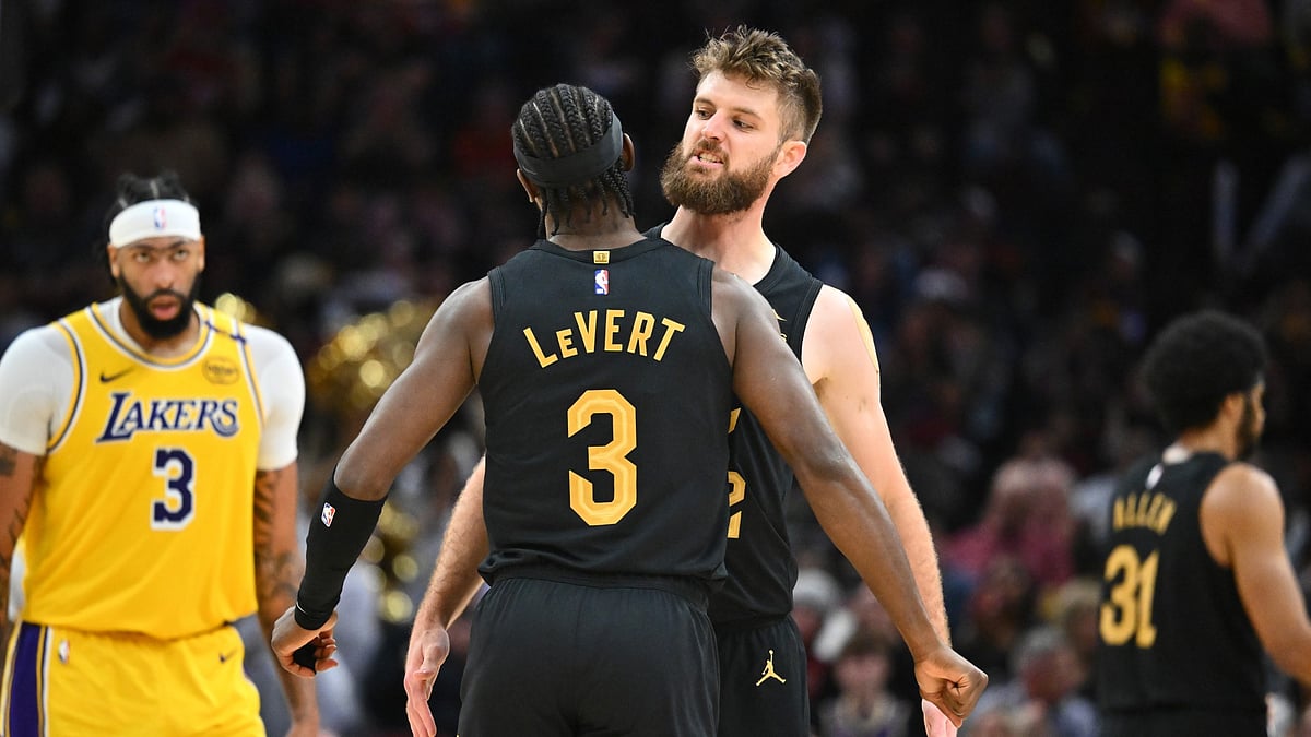 Caris LeVert #3 celebrates with Dean Wade #32 of the Cleveland Cavaliers during the third quarter during the third quarter against the Los Angeles Lakers at Rocket Mortgage Fieldhouse on October 30, 2024 in Cleveland, Ohio. The Cavaliers defeated the Lakers 134-110.