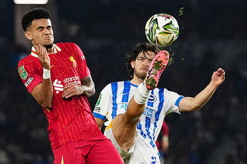 EFL Cup Quarter-Finals: Brighton's Ferdi Kadıoglu, right, kicks the ball by Liverpool's Luis Diaz 