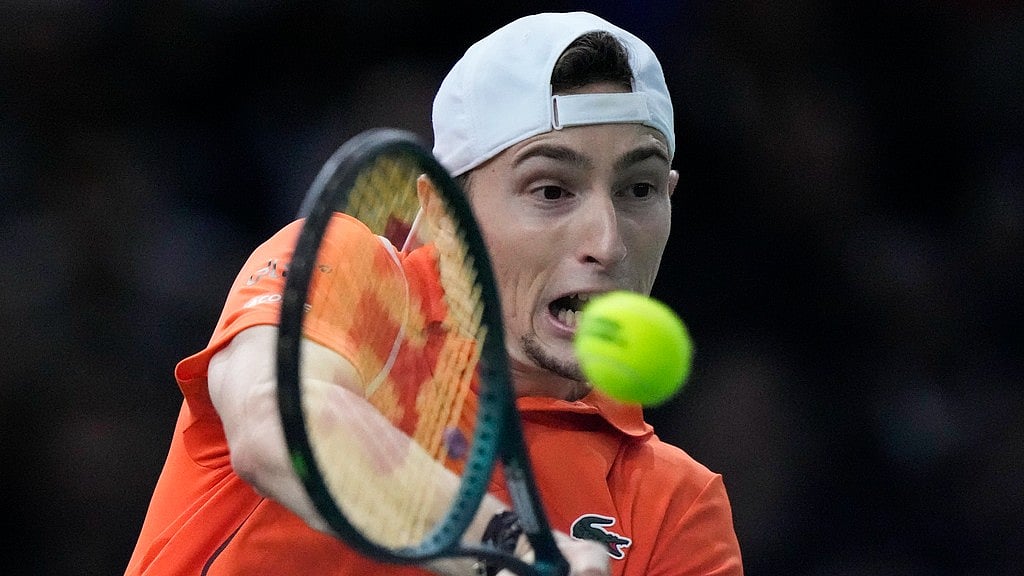 AP/Michel Euler : France's Ugo Humbert returns the ball to Spain's Carlos Alcaraz during a third round match at the Paris Masters tennis tournament at the Accor Arena.