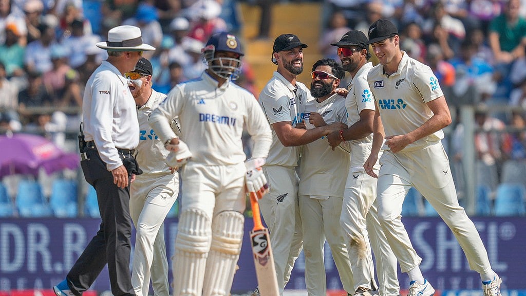 IND Vs NZ 3rd Test: Ajaz Patel, center, celebrates with teammates after the dismissal of India's Sarfaraz Khan during the third day at Wankhede Stadium. - AP