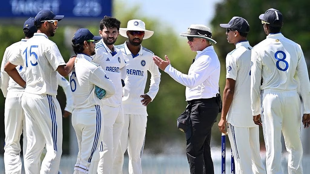 X : IND A vs AUS A: India A players question umpire Craig during their unofficial Test.