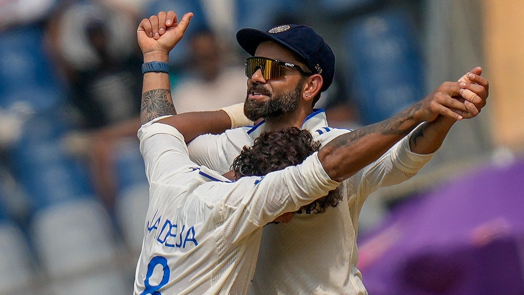 Virat Kohli and Ravindra jadeja in action during the third Test between India and New Zealand in Mumbai. - AP