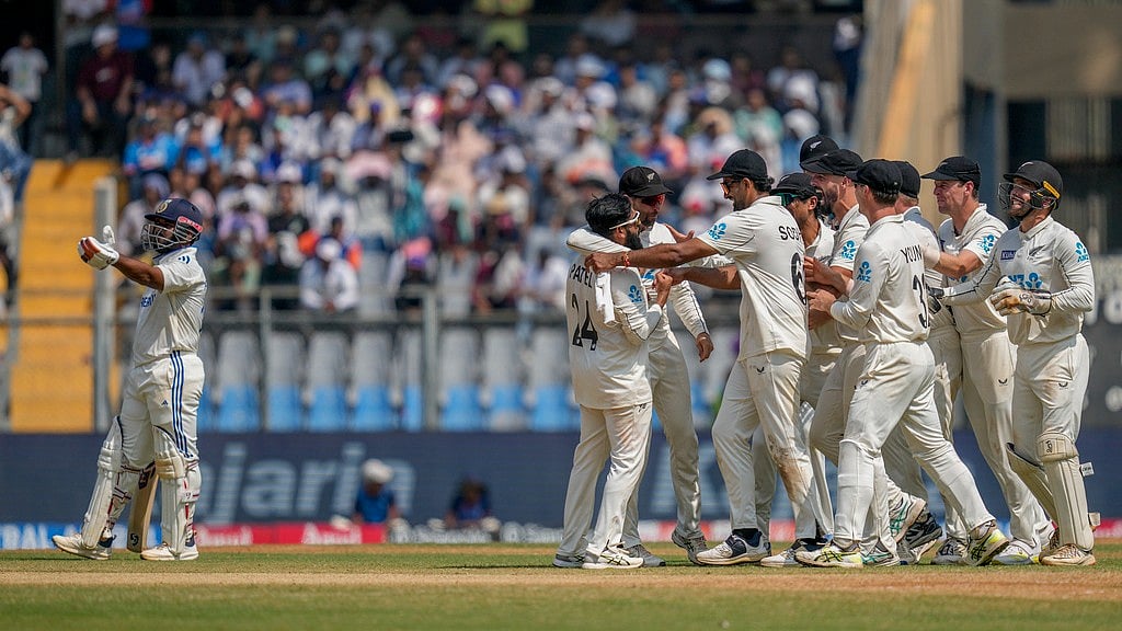 New Zealand celebrate the dismissal of Rishabh Pant (left) during the third day of the third cricket test match between India and New Zealand at Wankhede Stadium. - AP