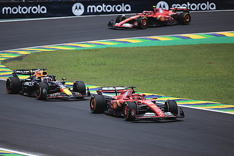 Brazilian Grand Prix 2024: Ferrari driver Charles Leclerc, right, followed by Red Bull driver Max Verstappen steer their cars 