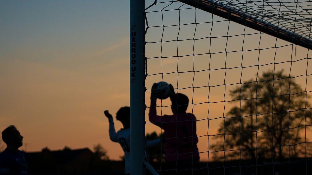 Representative image showing people playing football. - Unsplash