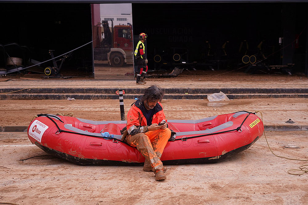 Spain flood aftermath photo gallery_A firefighter