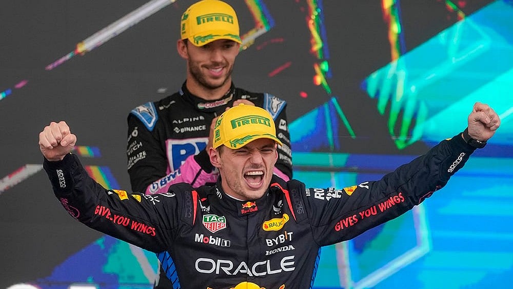 | Photo: AP/Andre Penner : Brazilian Grand Prix 2024: Red Bull driver Max Verstappen, of the Netherlands, celebrates on the podium