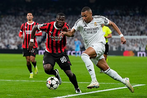 Champions League 2024-25: Real Madrid's Kylian Mbappe, right, and AC Milan's Yunus Musah battle for the ball