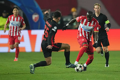 UEFA Champions League: Barcelona's Gerard Martín. left, and Red Star's Cherif Ndiaye fight for the ball