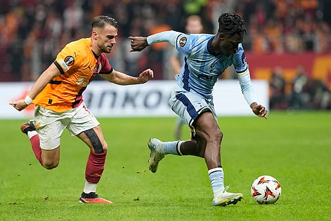 Europa League: Tottenham's Yves Bissouma challenges for the ball with Galatasaray's Yunus Akgun