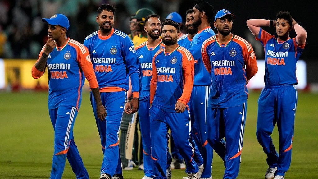 Suryakumar Yadav, left, with teammates leave the field at the end of the T20 International cricket match between South Africa and India, at Kingsmead stadium in Durban. - AP