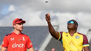 AP/Ricardo Mazalan : Captains Jos Buttler and Rovman Powell at the toss for the West Indies vs England, 1st T20I in Barbados.