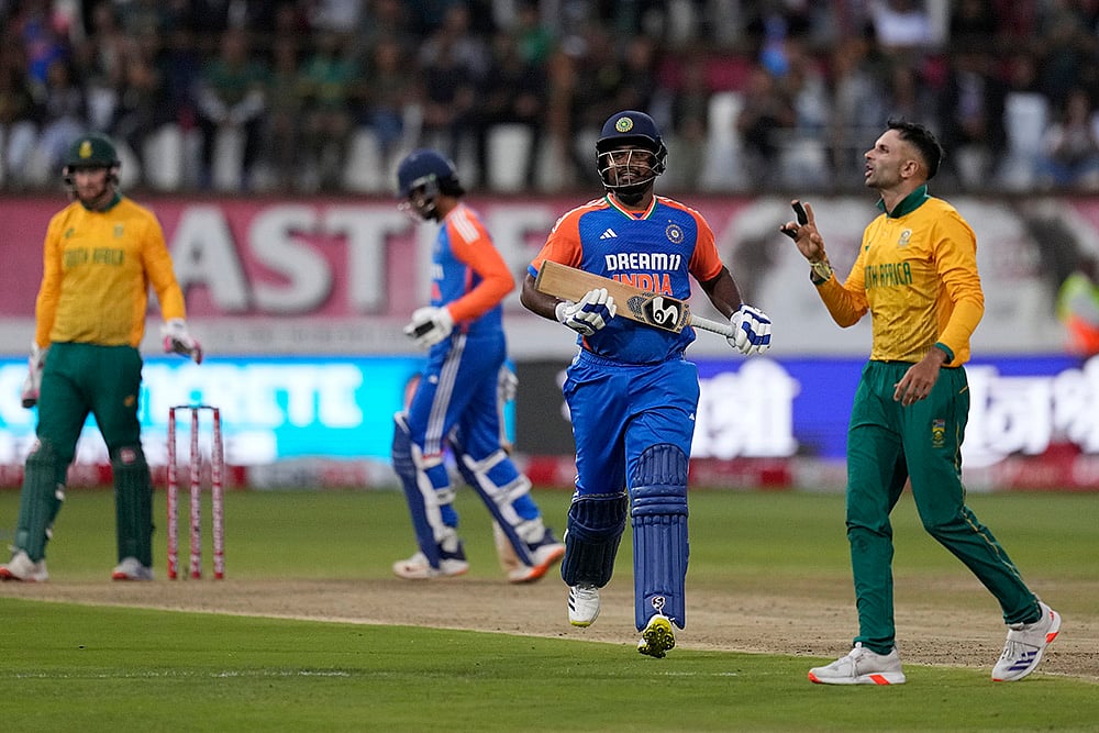 | Photo: AP/Themba Hadebe : South Africa vs India: India's batsman Sanju Samson, centre, runs as he reaches his 100 runs