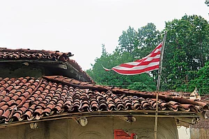 | Photo: Vikram Sharma : Religion and Politics: Sarna flag atop a house in Arakeram village, Ormanjhi block, Ranchi