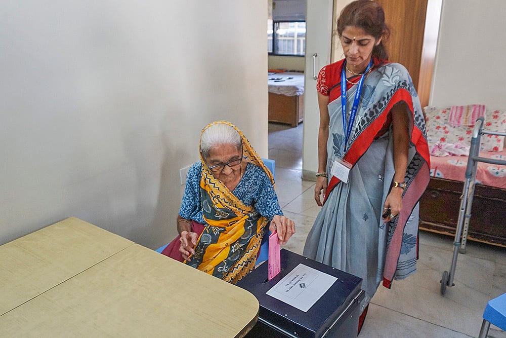 | Photo: PTI : Home voting for elderly for Maharashtra polls
