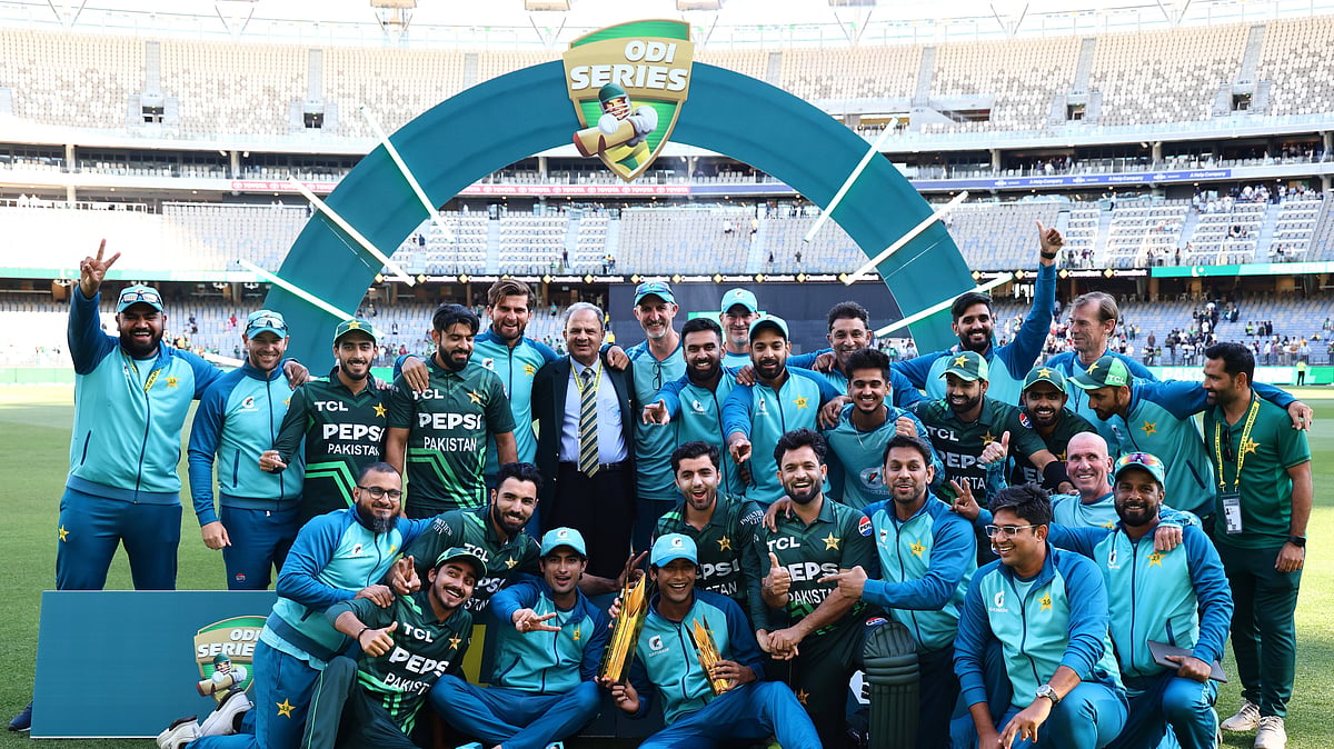The Pakistan team pose with their trophy. AP Photo