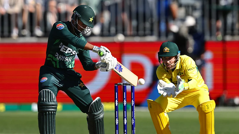 Pakistans Saim Ayub, left, bats in front of Australias Josh Inglis. AP Photo