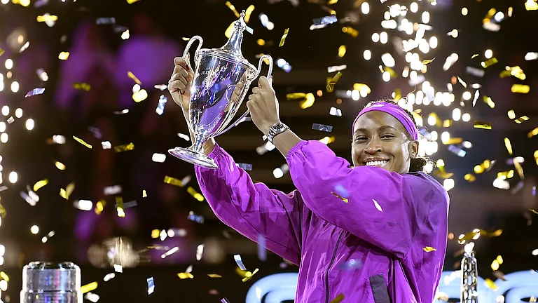 Coco Gauff of the U.S. holds her trophy after winning against China's Qinwen Zheng in their women's singles final match of the WTA finals at the King Saud University Indoor Arena, in Riyadh. - AP Photo