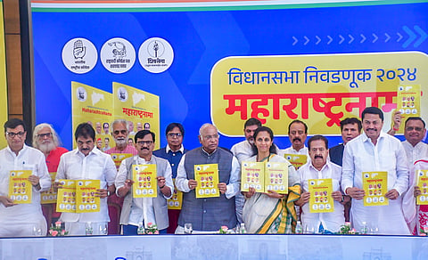 Congress President Mallikarjun Kharge, AICC General Secretary K.C. Venugopal, Maharashtra Congress President Nana Patole, party leaders Balasaheb Thorat and Ramesh Chennithala, Shiv Sena (UBT) MP Sanjay Raut and NCP (SP) MP Supriya Sule release Maha Vikas Aghadi's manifesto for Maharashtra Assembly elections, in Mumbai, Sunday, Nov. 10, 2024.