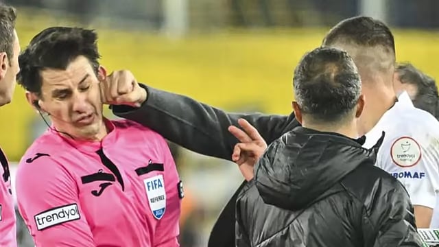Referee Halil Umut Meler being punched in the face by MKE Ankaragucu president Faruk Koca. - File