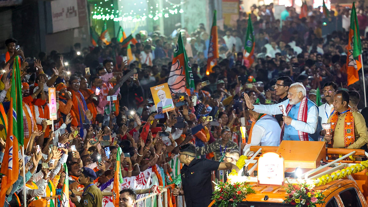 PTI : Prime Minister Narendra Modi, Union Minister of State for Defence Sanjay Seth and others during an election roadshow ahead of the Jharkhand Assembly elections, in Ranchi, Sunday, Nov. 10, 2024. 