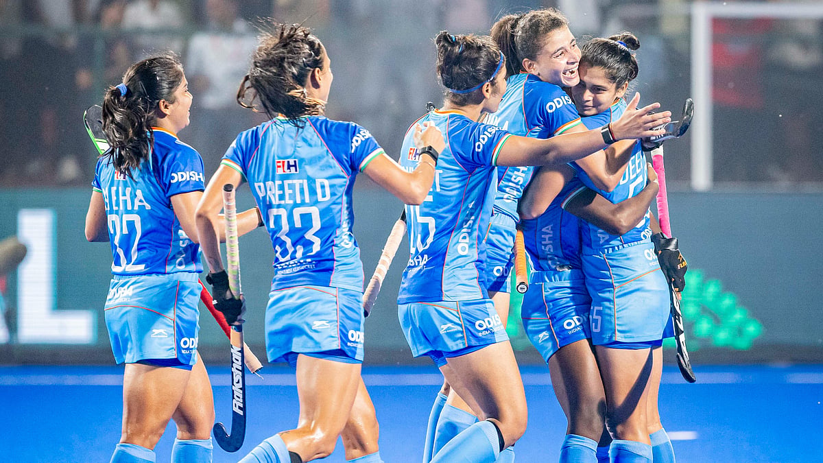 Photo: Hockey India : Deepika (right) celebrates with teammates after scoring a goal during India's clash against South Korea in the Women's Champions Trophy in Rajgir, Bihar.