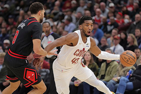 NBA Cavaliers vs Bulls: Cavaliers guard Donovan Mitchell drives to the basket against Bulls guard Zach LaVine 