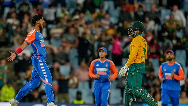 Indias Arshdeep Singh, left, celebrates the dismissal. AP Photo