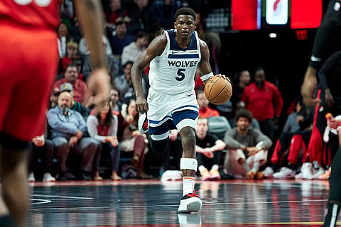 NBA Cup: Timberwolves guard Anthony Edwards brings the ball up court against the Trail Blazers 