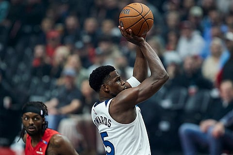 NBA Cup: Timberwolves guard Anthony Edwards, right, shoots in front of Trail Blazers forward Jerami Grant 