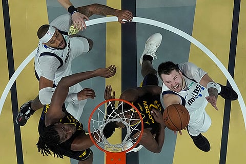 NBA Cup: Mavericks guard Luka Doncic, right, shoots against the Warriors 