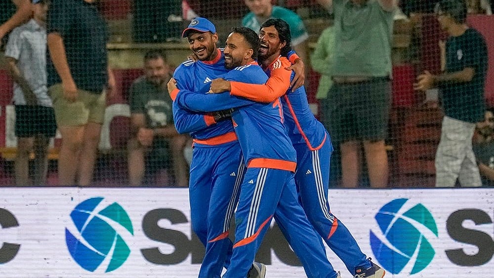 | Photo: AP/Themba Hadebe : Ind vs SA 3rd T20I: India's Axar Patel, left, celebrates with teammates after the dismissal of South Africa's David Miller 