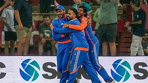 | Photo: AP/Themba Hadebe : Ind vs SA 3rd T20I: India's Axar Patel, left, celebrates with teammates after the dismissal of South Africa's David Miller