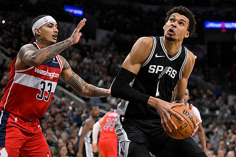 NBA: Spurs forward Victor Wembanyama (1) drives against Wizards' Kyle Kuzma
