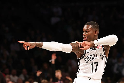 NBA: Nets' Dennis Schroder celebrates after scoring a three-point basket 