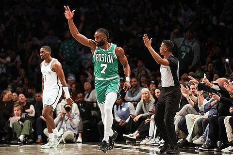 NBA: Celtics' Jaylen Brown reacts after scoring a three-point basket