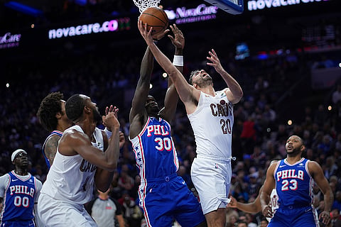 NBA: Cavaliers' Georges Niang (20) goes up for a shot against 76ers' Adem Bona (30)