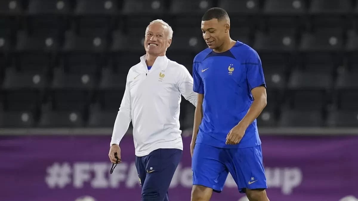 France coach Didier Deschamps (L) arrives for a team training session with Mbappe. - File