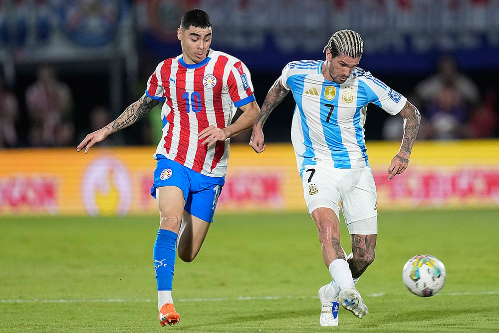 FIFA World Cup 2026 Qualifiers Paraguay vs Argentina soccer match photos_Rodrigo De Paul
