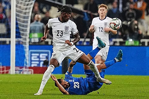 UEFA Nations League soccer: England's Noni Madueke, left, and Manolis Siopis of Greece fight for the ball 
