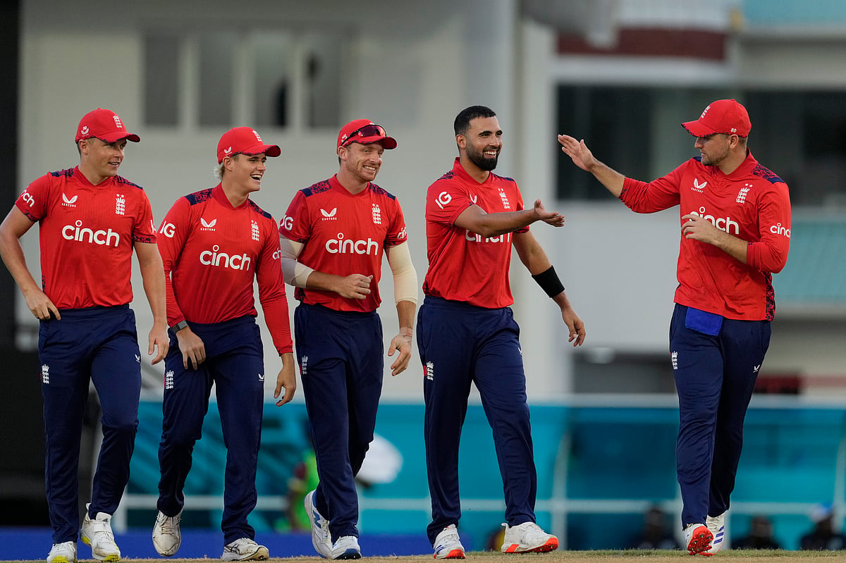(AP Photo/Ricardo Mazalan) : England's Saqib Mahmood celebrates with teammates the dismissal of West Indies' Evin Lewis during the third T20 cricket match at Daren Sammy National Cricket Stadium in Gros Islet, St.Lucia, Thursday, Nov. 14, 2024. 