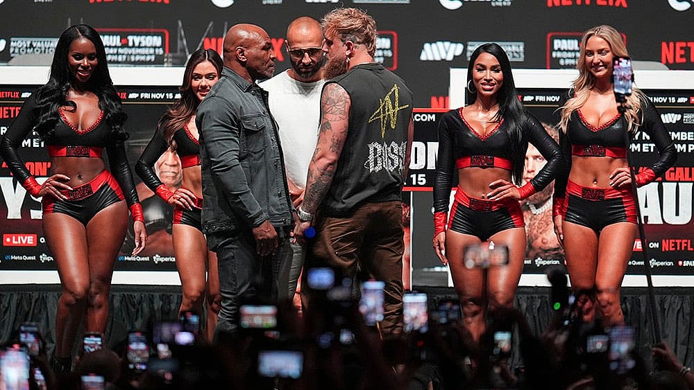| Photo: AP/Julio Cortez : Tyson vs Paul boxing: Mike Tyson and Jake Paul face off during a news conference