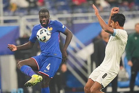 UEFA Nations League soccer: France's Dayot Upmecano, left, kicks the ball past Israel's Dor Peretz 