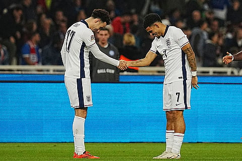 UEFA Nations League soccer: England's Curtis Jones, left, shakes hands as celebrates with his teammate Morgan Gibbs-White, after scoring the third goal 
