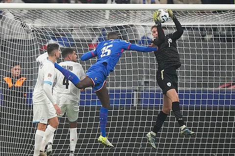 UEFA Nations League soccer: Israel's goalkeeper Daniel Peretz takes the ball 