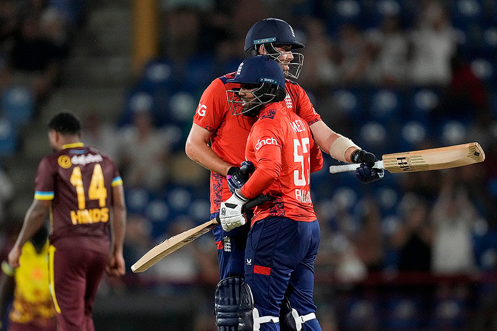 | Photo: AP/Ricardo Mazalan : WI Vs ENG, 3rd T20I: England's Jamie Overton, center, and Rehan Ahmed celebrated defeating West Indies