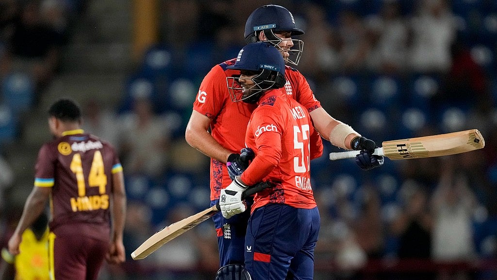 AP/Ricardo Mazalan : England's Jamie Overton, center, and Rehan Ahmed celebrated defeating West Indies by 3 wickets.