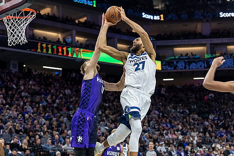 NBA: Kings forward Domantas Sabonis (11) blocks Timberwolves center Rudy Gobert 