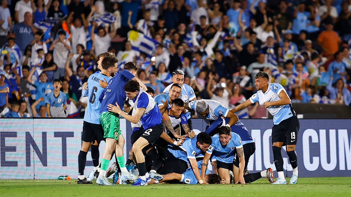 Uruguay's players mob Manuel Ugarte after his dramatic winner